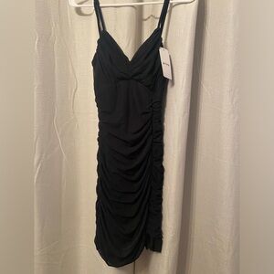 Shirred black mini dress. NWT
